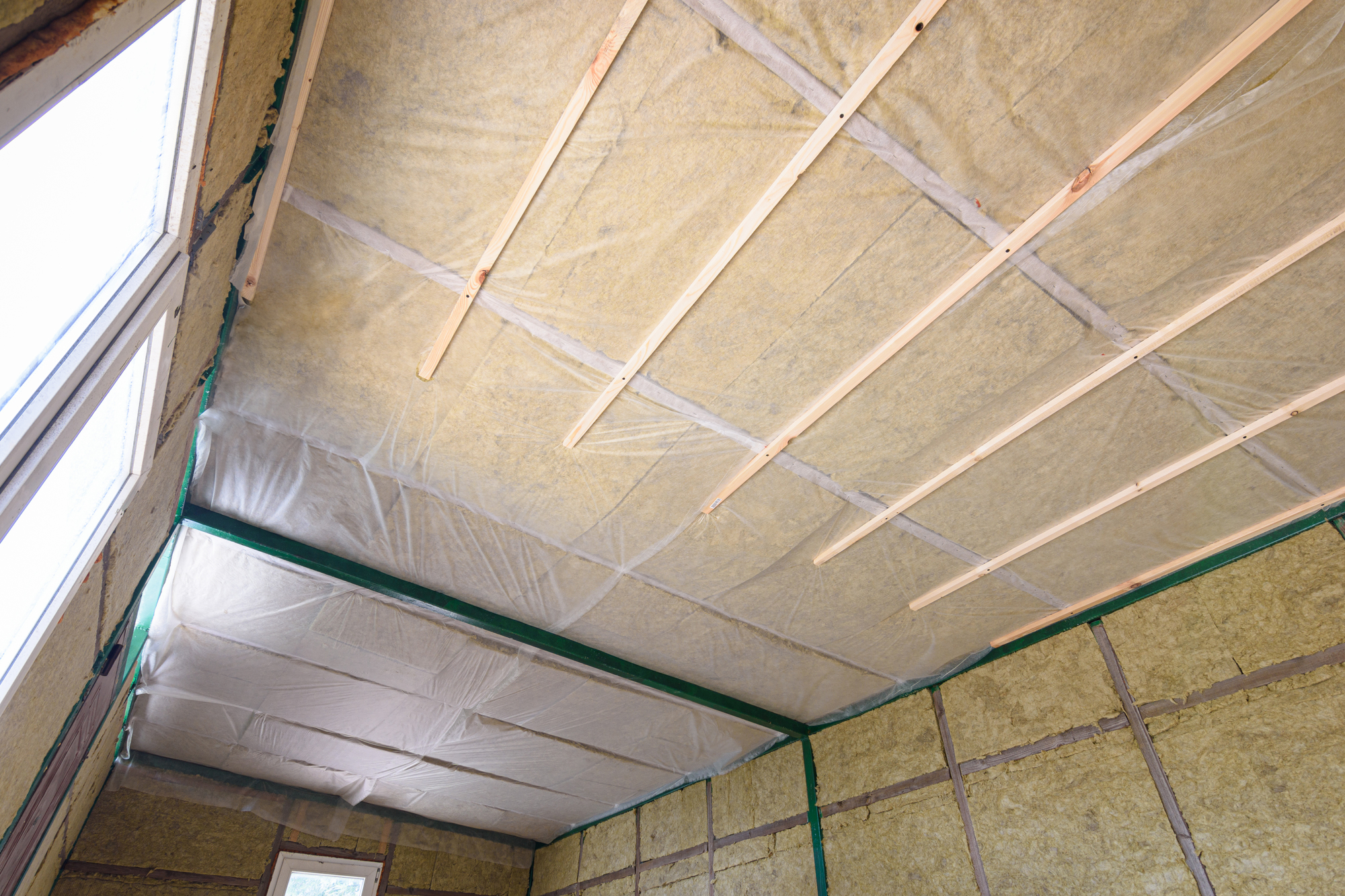 Insulation of the roof from the inside with mineral wool in a wooden country house